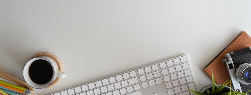 Keyboard and coffee on  desk