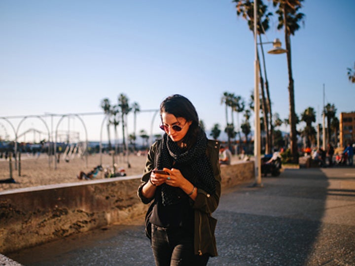 Young woman working on her phone